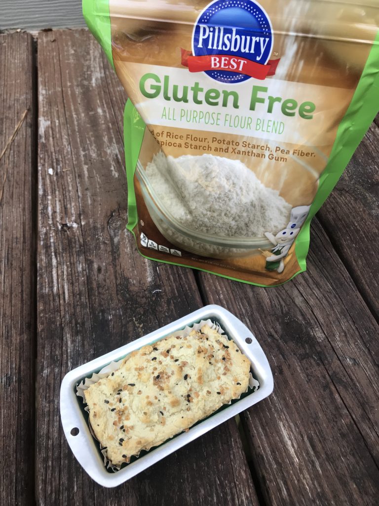 A mini loaf of bread with Pillsbury flour in the background