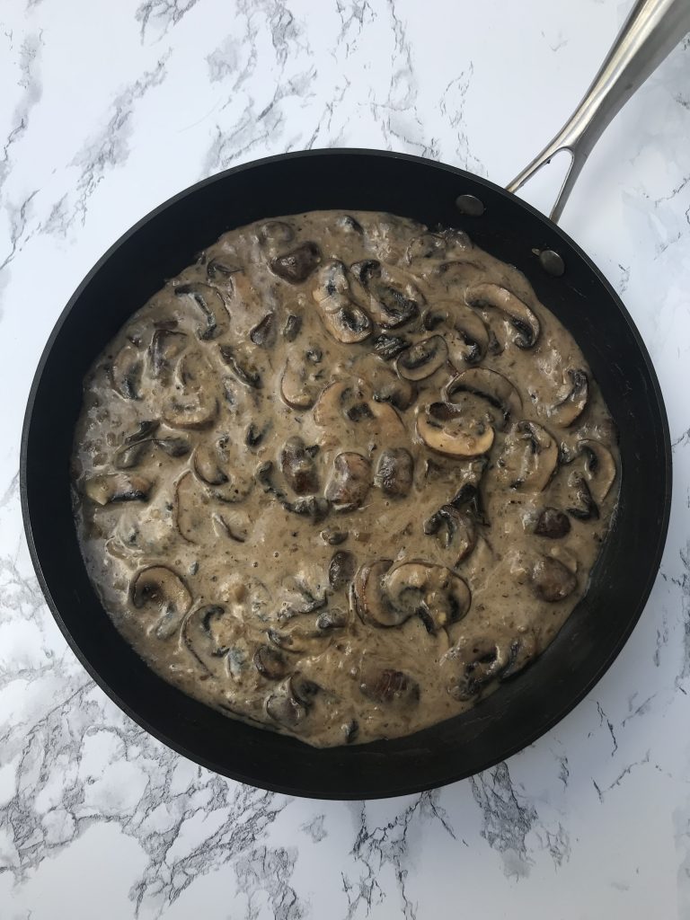 A skillet of mushroom stroganoff sauce