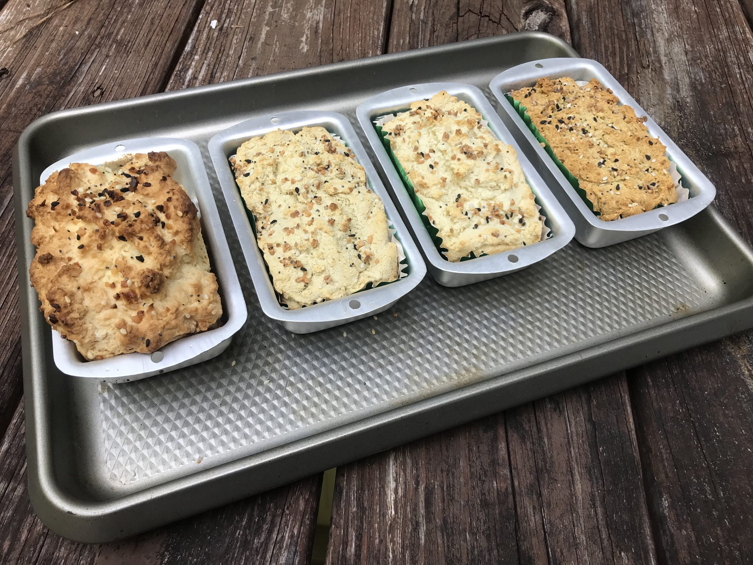 4 mini loaves of bread on a sheet pan
