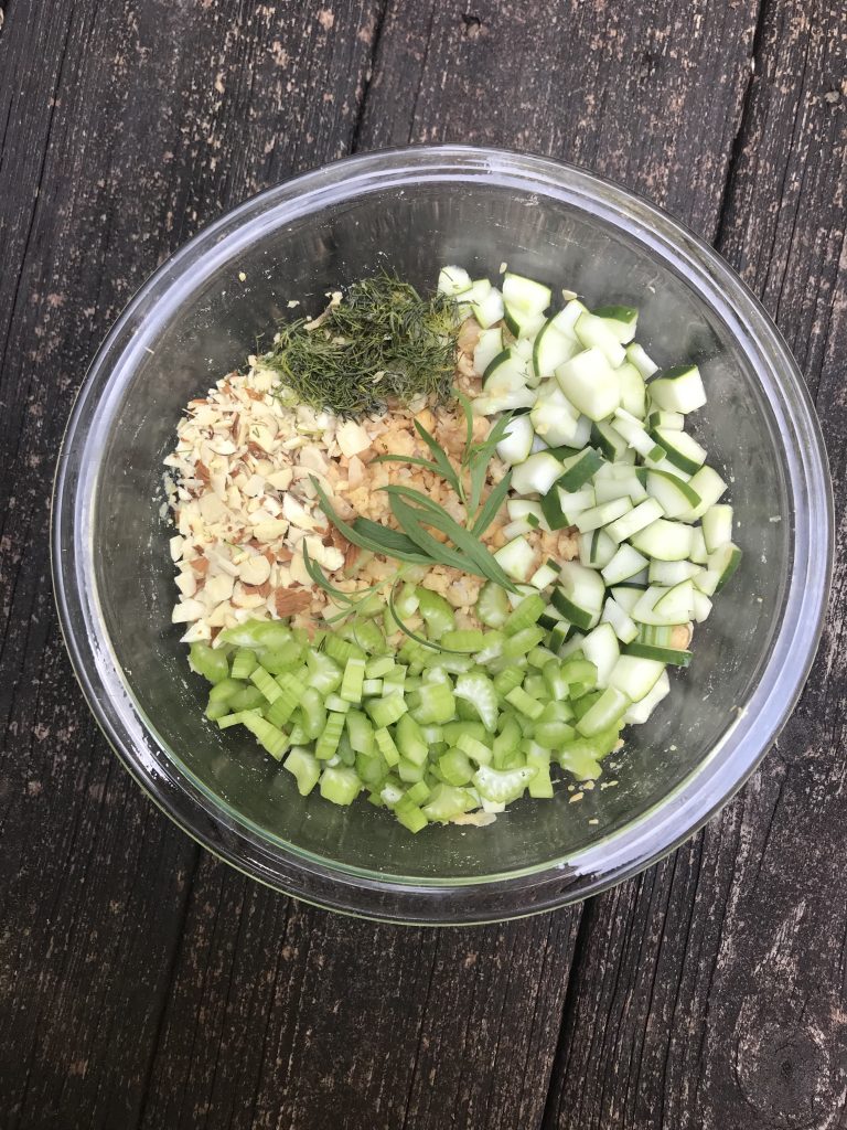 A bowl with the chickpea salad ingredients unmixed