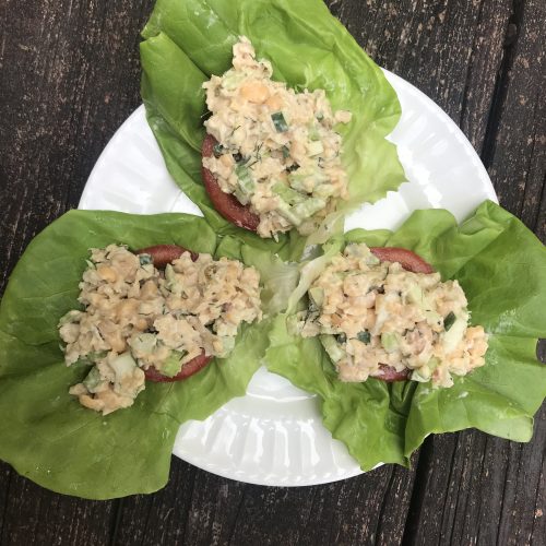 Lettuce wraps with tomato slices and chickpea salad