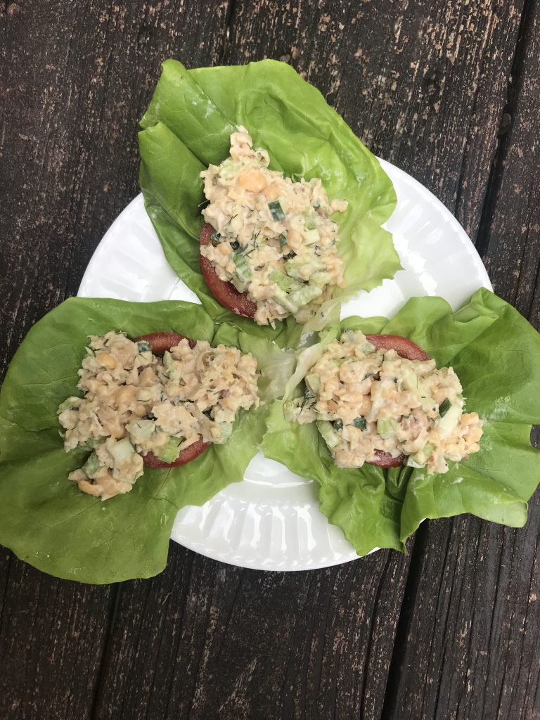 Lettuce wraps with tomato slices and chickpea salad