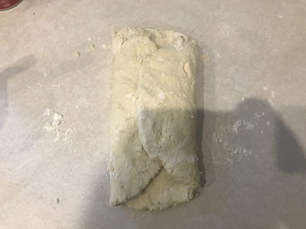 the biscuit dough folded into thirds