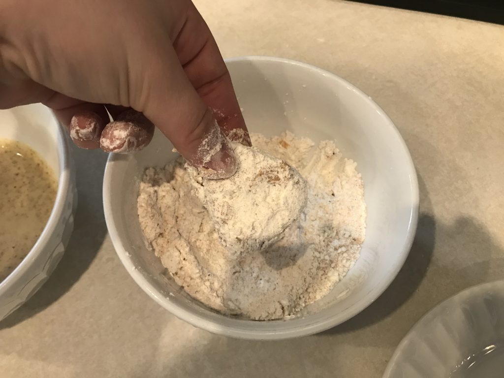 a piece of Quorn covered in flour to fry