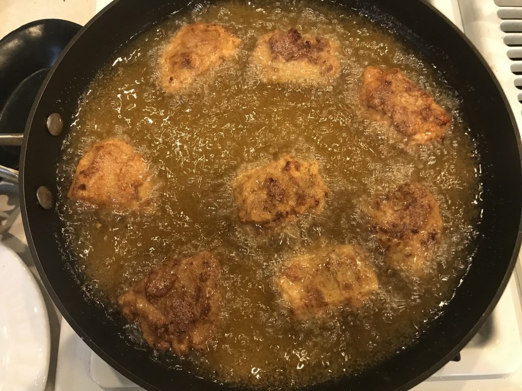 pieces of Quorn frying in hot oil