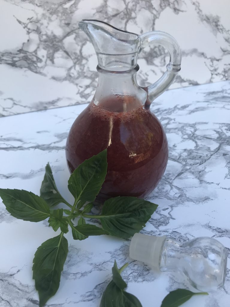 a bottle of concentrated strawberry basil vinegar