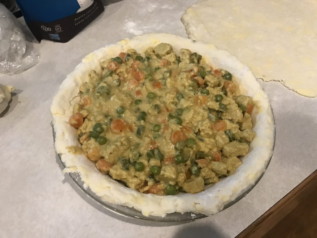 the uncooked pot pie with the bottom crust and filling