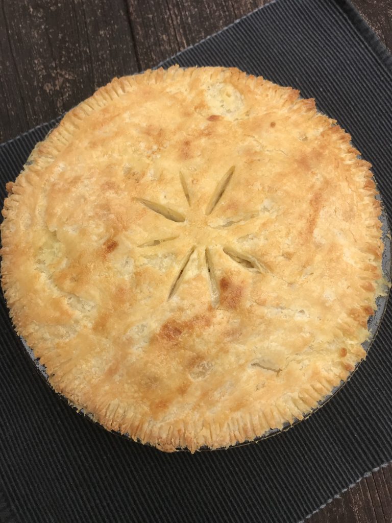 the cooked gluten free vegetable pot pie with a golden brown crust