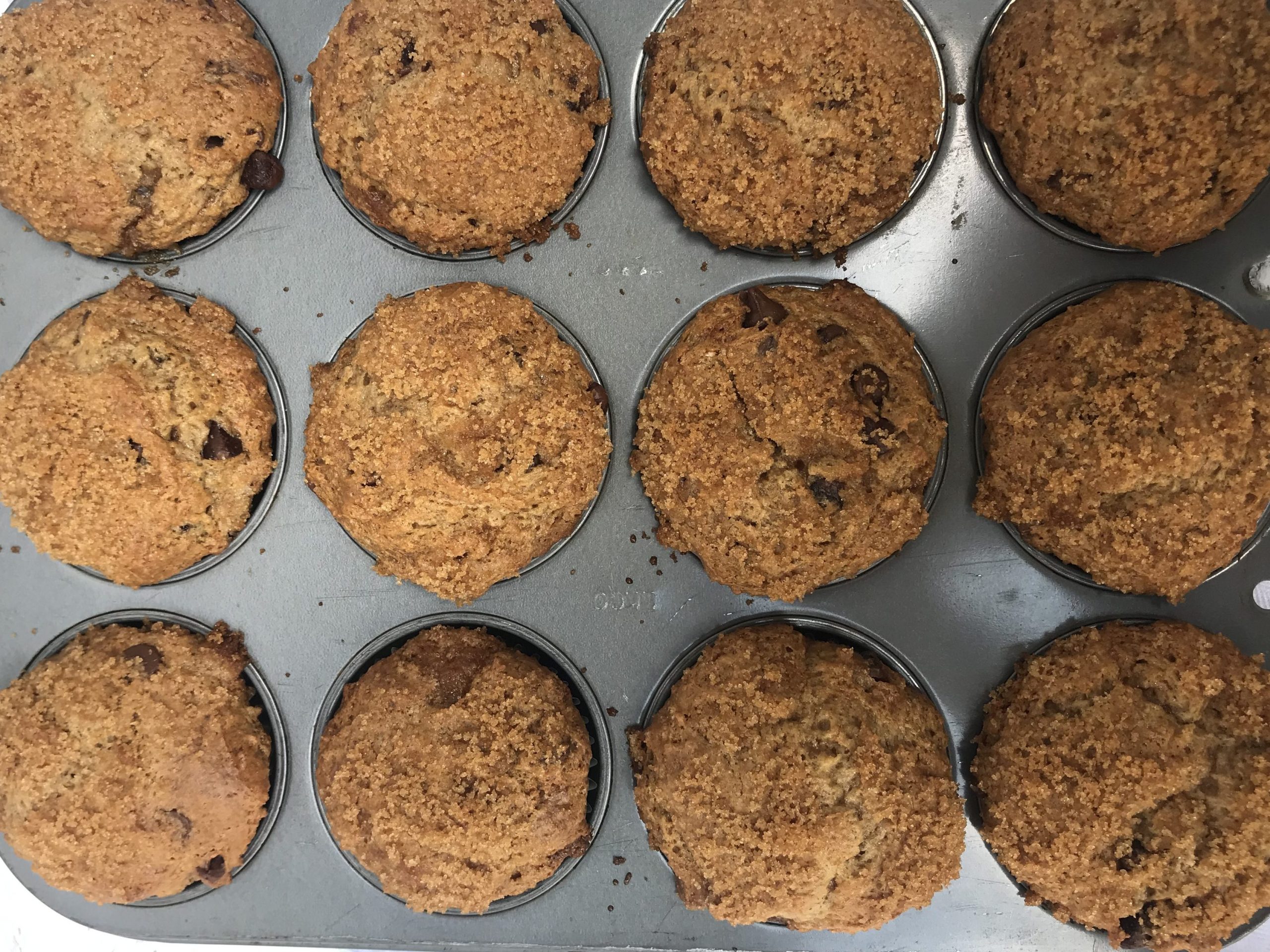 a tray of cinnamon chocolate chip muffins